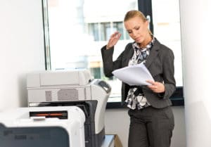 woman working on copy machine