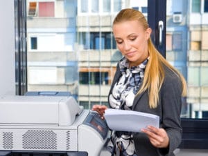 woman secretary with copy machine